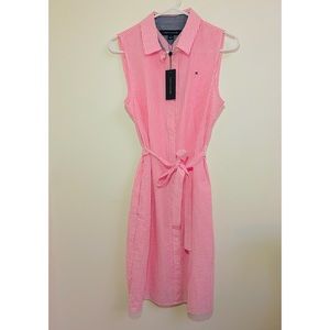 Aortic. 37’’ long, fold collar, button front closures, pockets at sides.